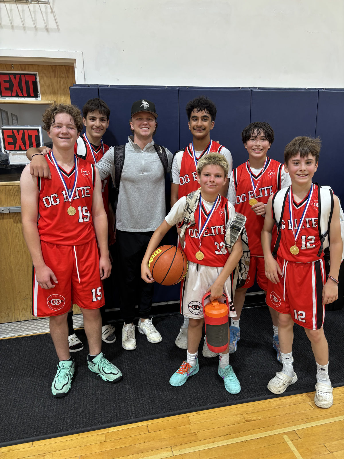 OG Elite Basketball team and coach with medals